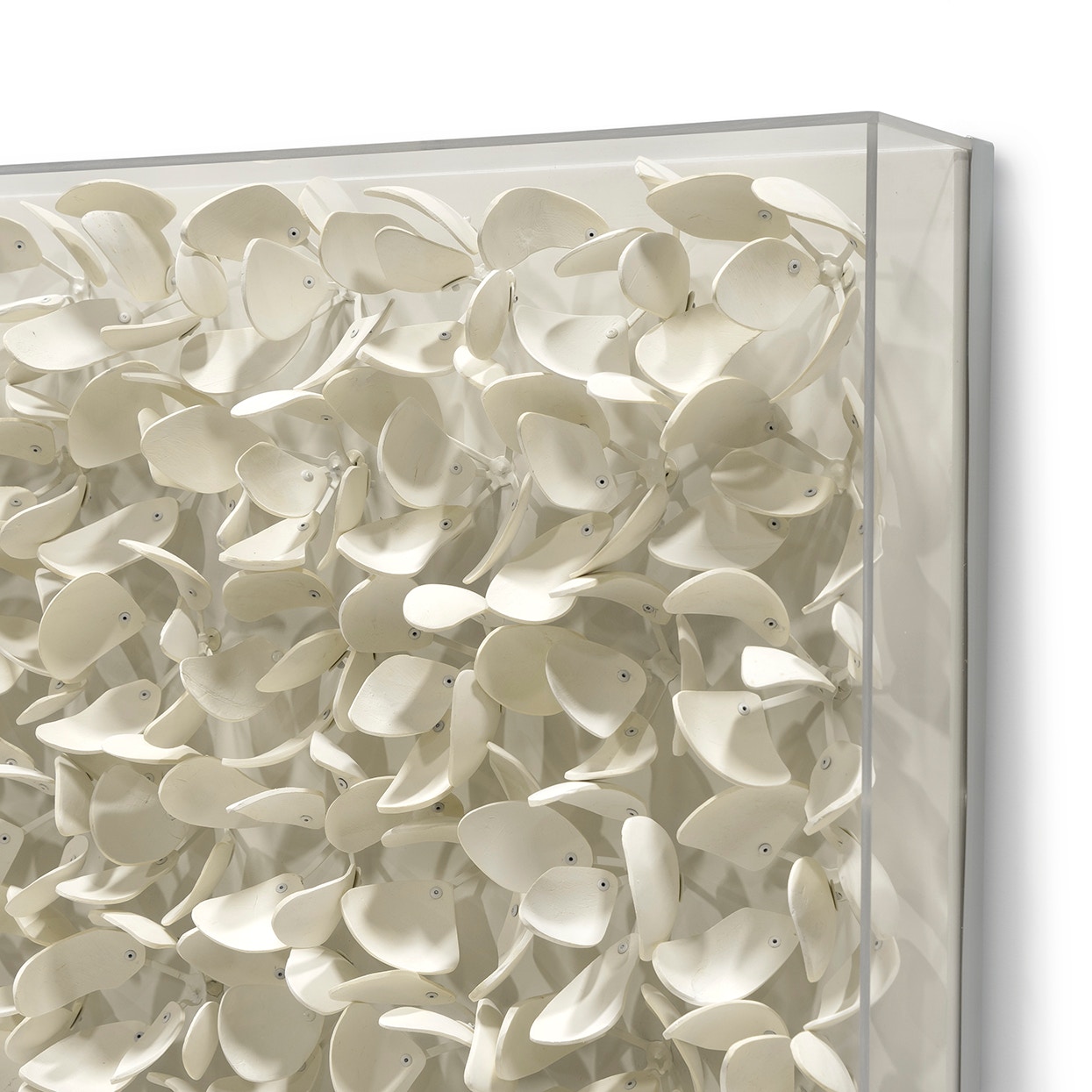 Hand-cut coco wood in petal forms in off-white finish with a clear