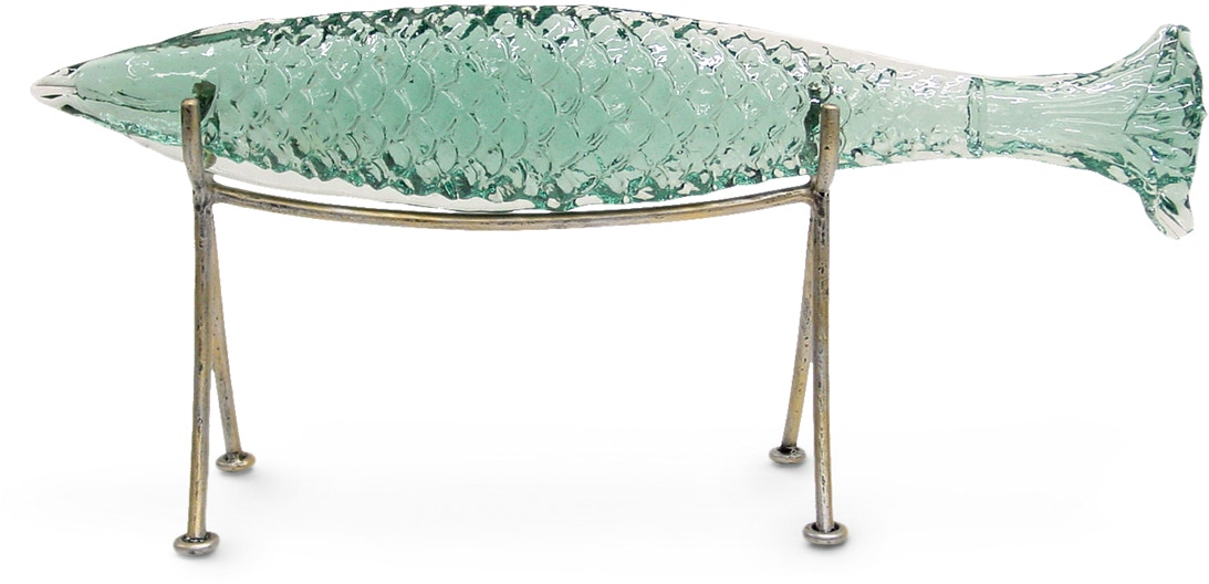 Hand-cast recycled glass fish sits loose on a wrought iron silver finish  stand.