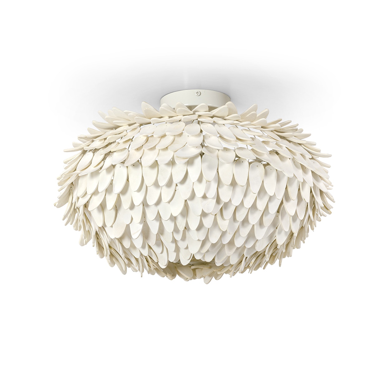 Hand-cut oval shaped coco shells layered on a metal frame in an
