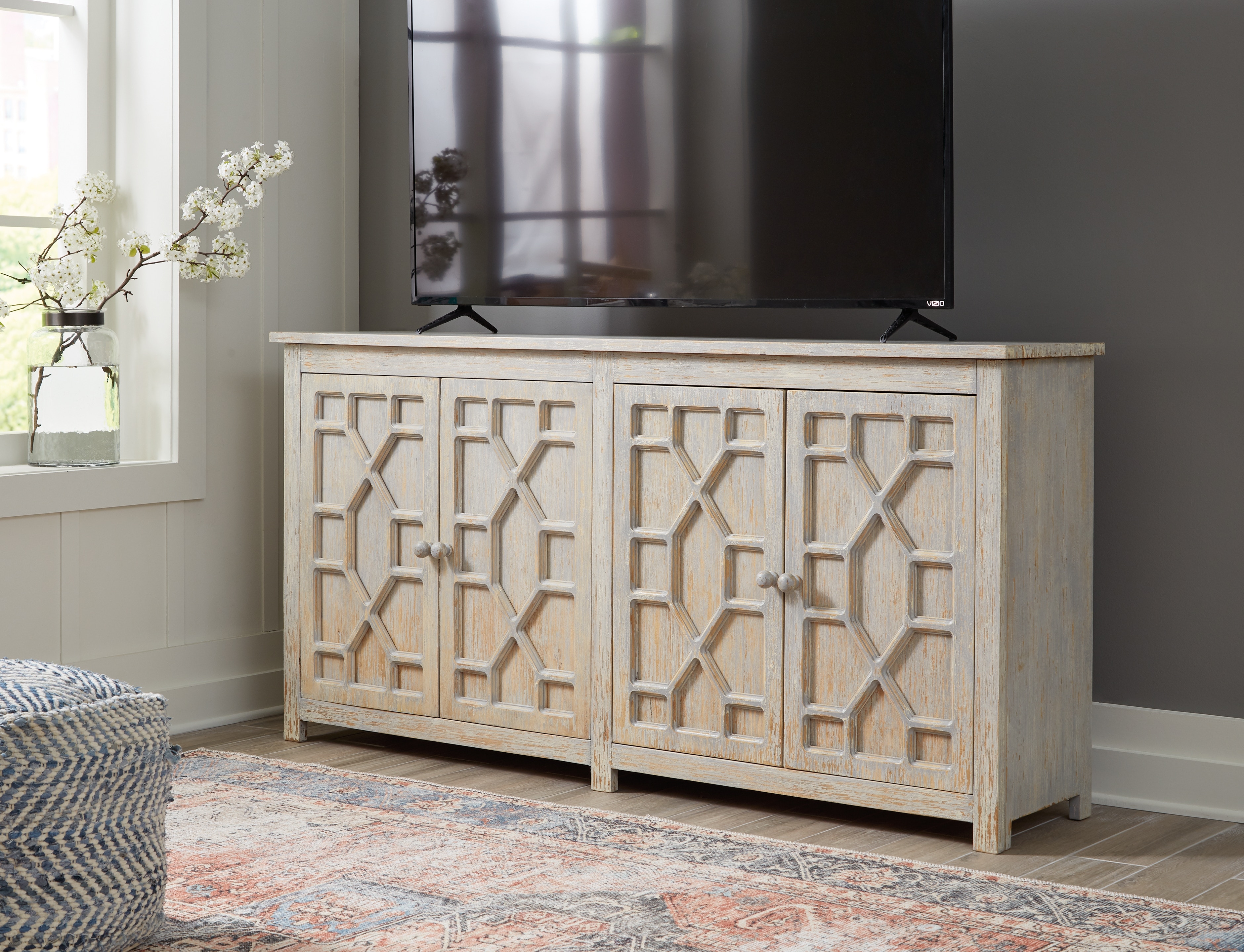 Signature Design by Ashley Living Room Caitrich Accent Cabinet