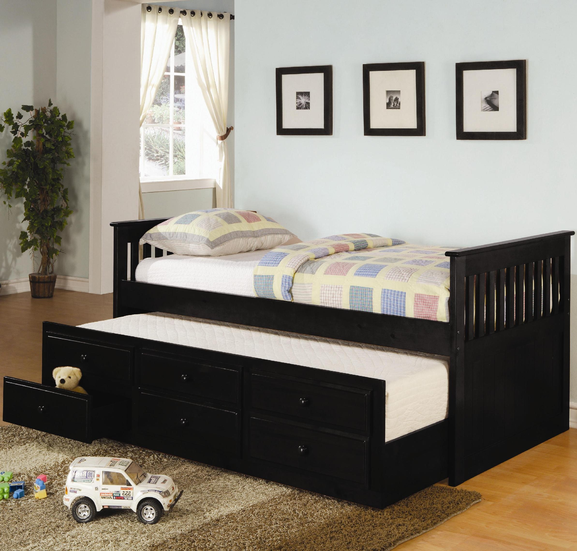 Black full size bed with outlet trundle