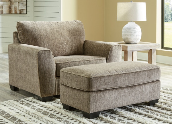 Gray chair and a online half with ottoman